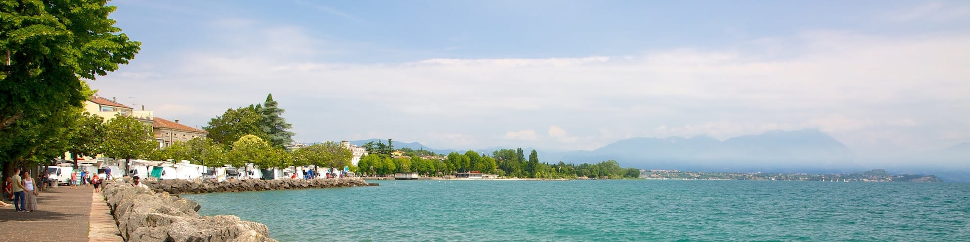 Desenzano del Garda which includes general coastal views and rocky coastline