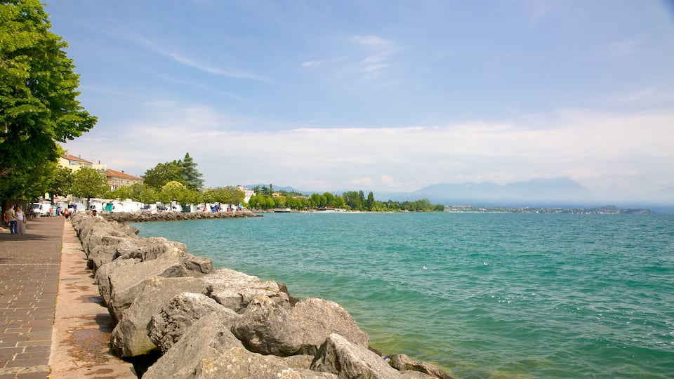 Desenzano del Garda which includes general coastal views and rocky coastline