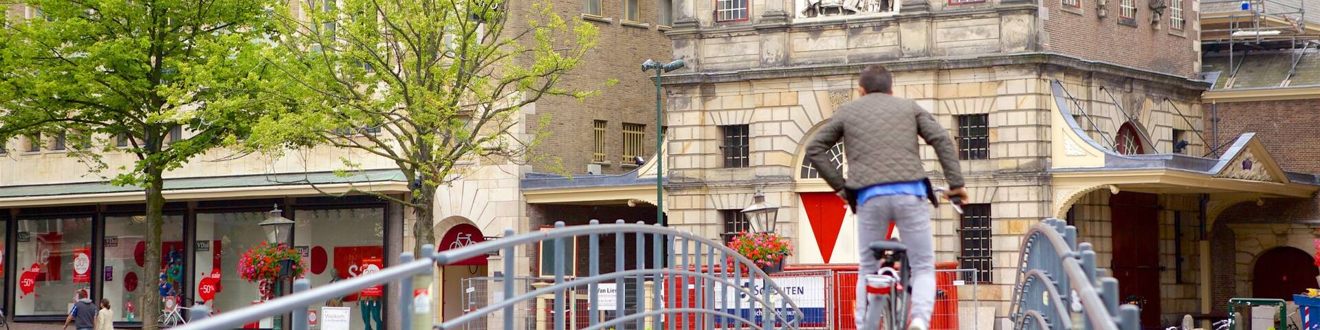 Waag which includes road cycling, heritage architecture and street scenes