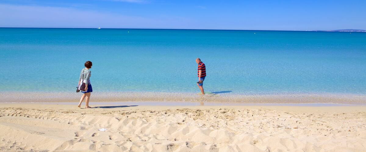 Palma de Mallorca which includes a beach as well as a couple