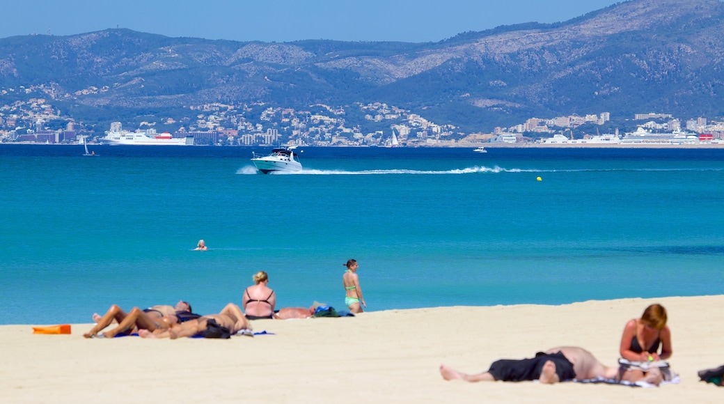 Palma de Mallorca featuring a beach as well as a small group of people