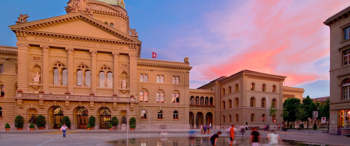 Bundeshaus which includes heritage architecture, a sunset and an administrative building