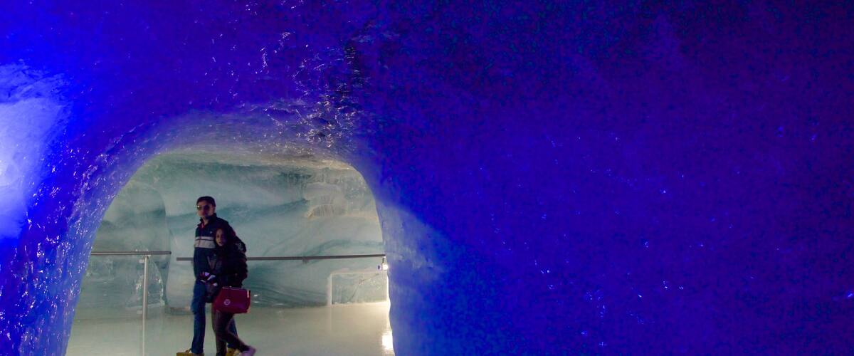 Jungfraujoch featuring caves and interior views as well as a couple