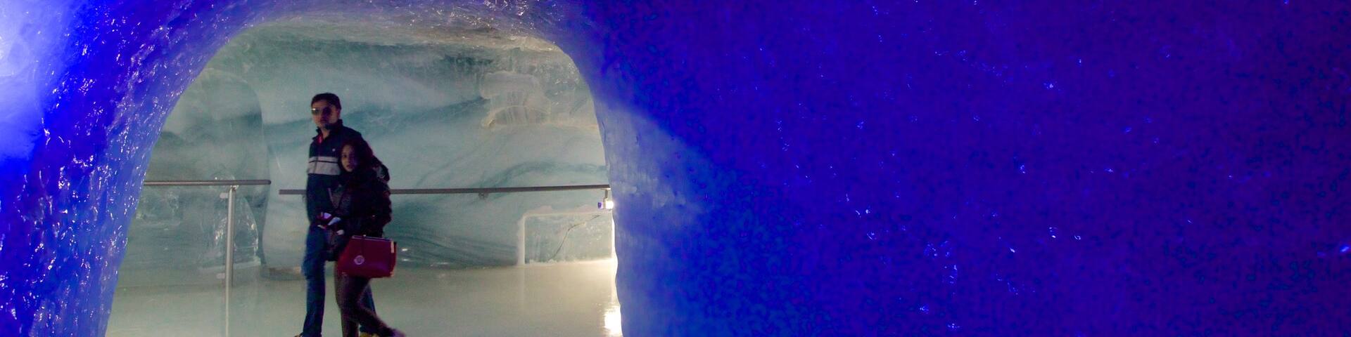 Jungfraujoch featuring caves and interior views as well as a couple