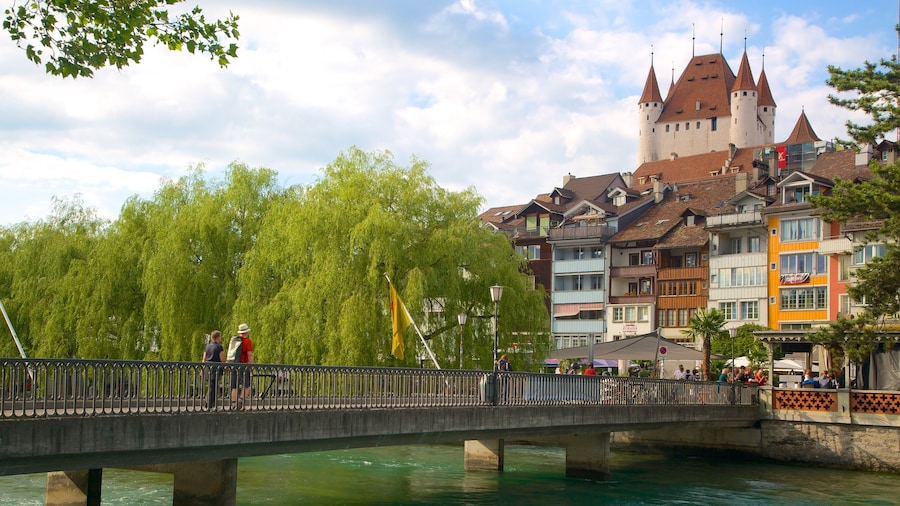 Thun Castle showing a bridge, a river or creek and a castle