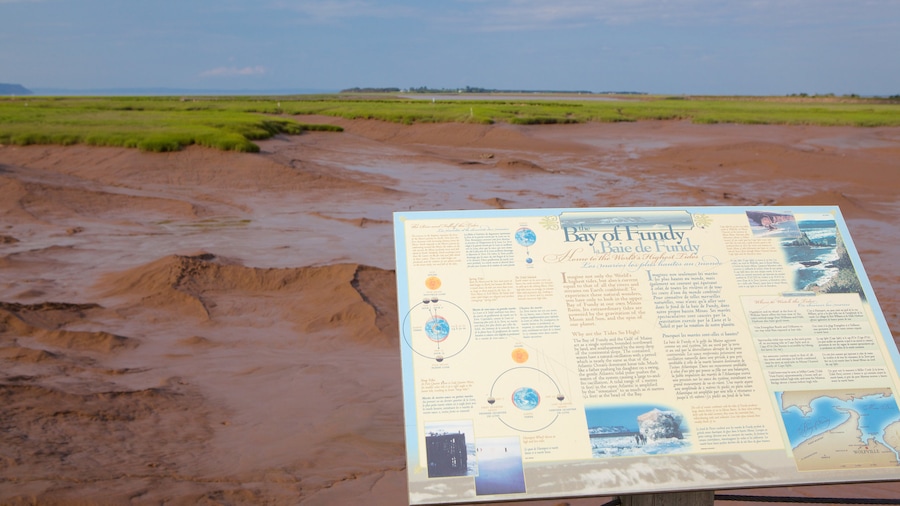 Wolfville which includes tranquil scenes and signage