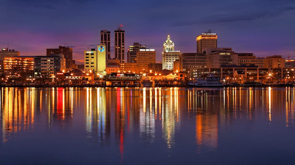 Peoria featuring night scenes, a lake or waterhole and a sunset