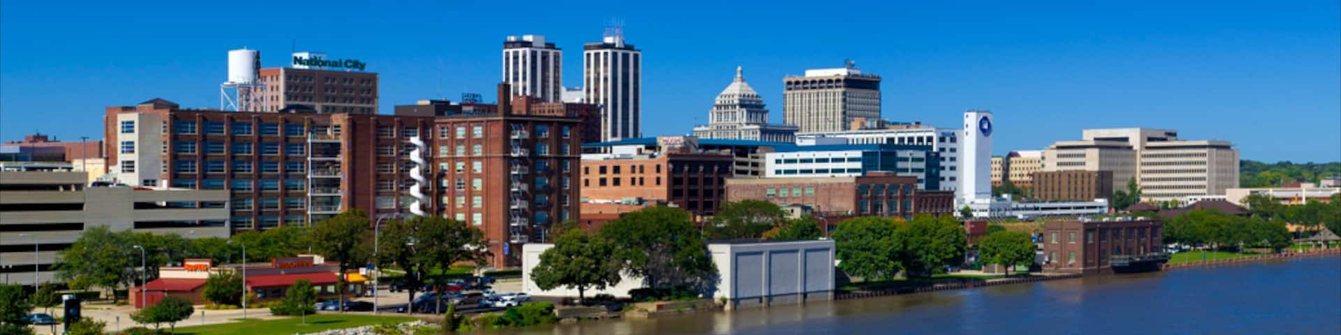 Peoria featuring a lake or waterhole, skyline and a city