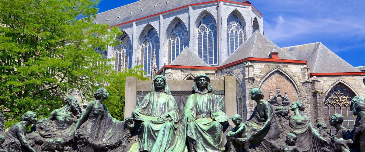 Saint Bavo Cathedral showing outdoor art, religious elements and a church or cathedral