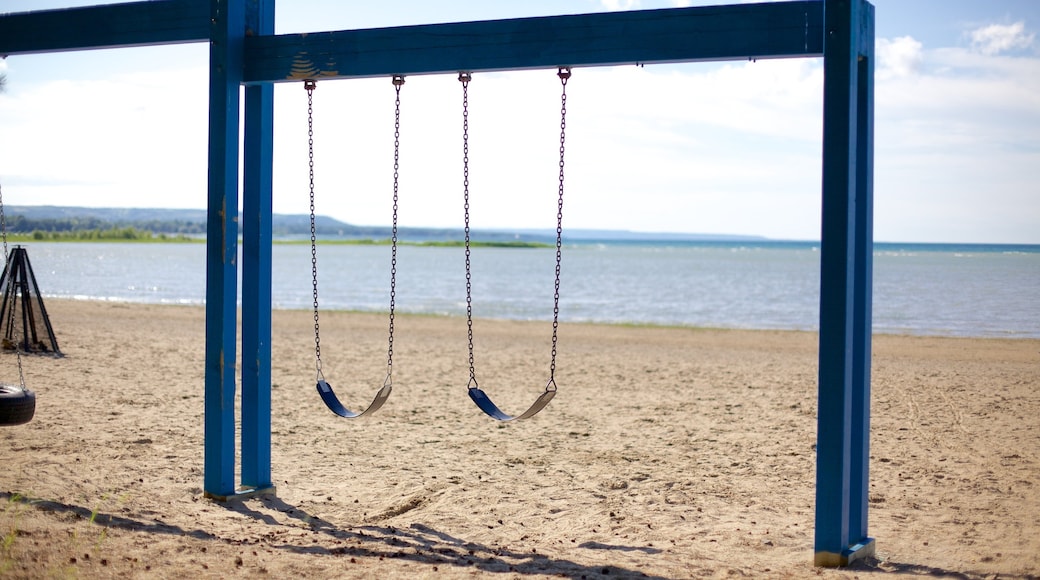 Blue Mountain Beach featuring a playground and a sandy beach