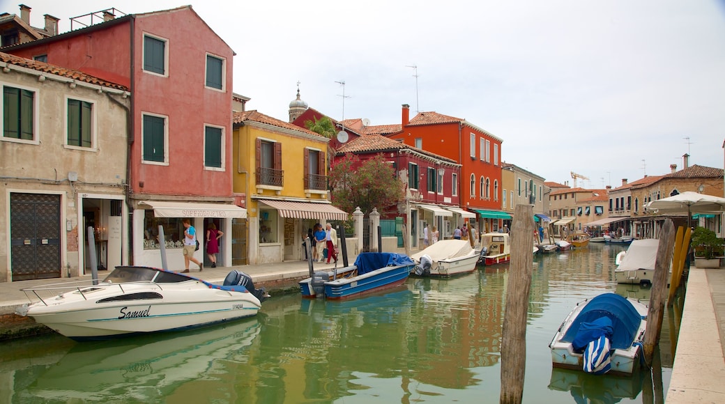 Murano which includes a house and a river or creek