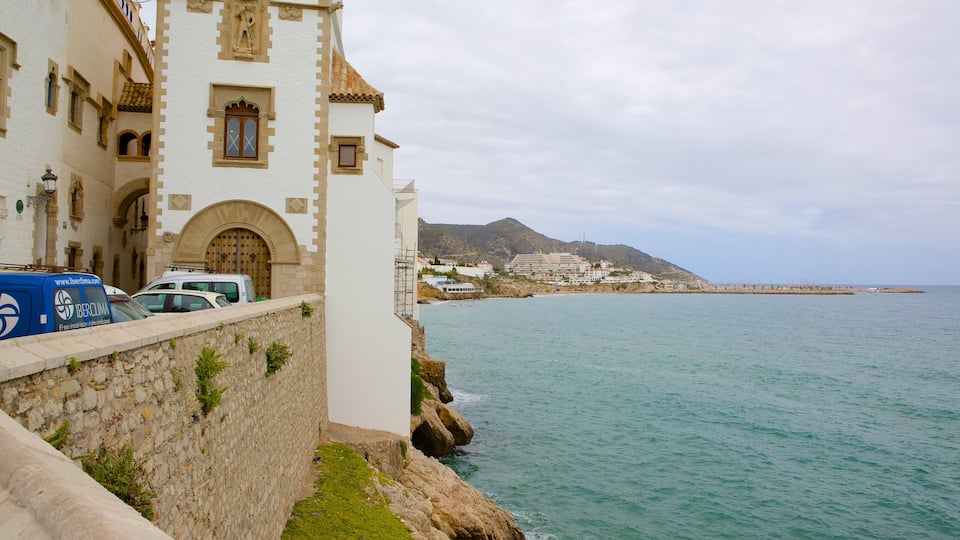 Sitges showing rugged coastline and heritage architecture