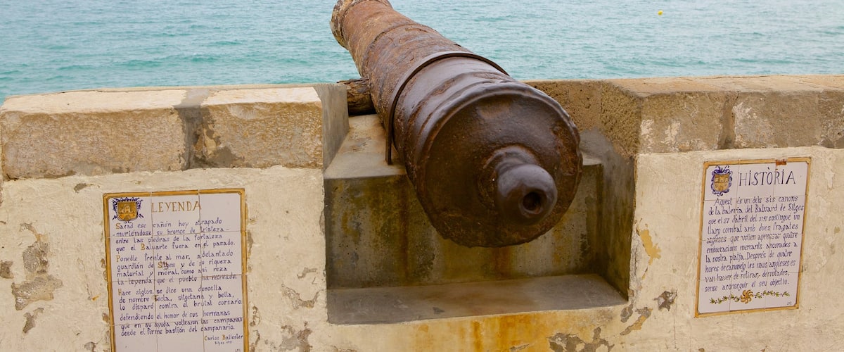 Sitges which includes military items and general coastal views
