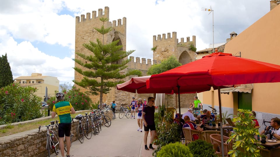 Alcudia which includes château or palace, heritage architecture and outdoor eating