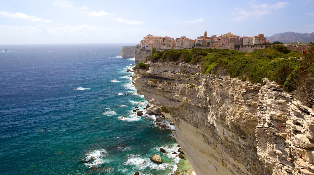 Bonifacio featuring rocky coastline and a coastal town