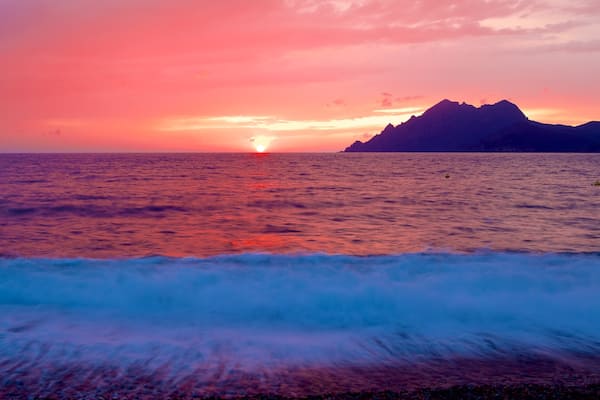 Plage de Porto mettant en vedette vues littorales et coucher de soleil