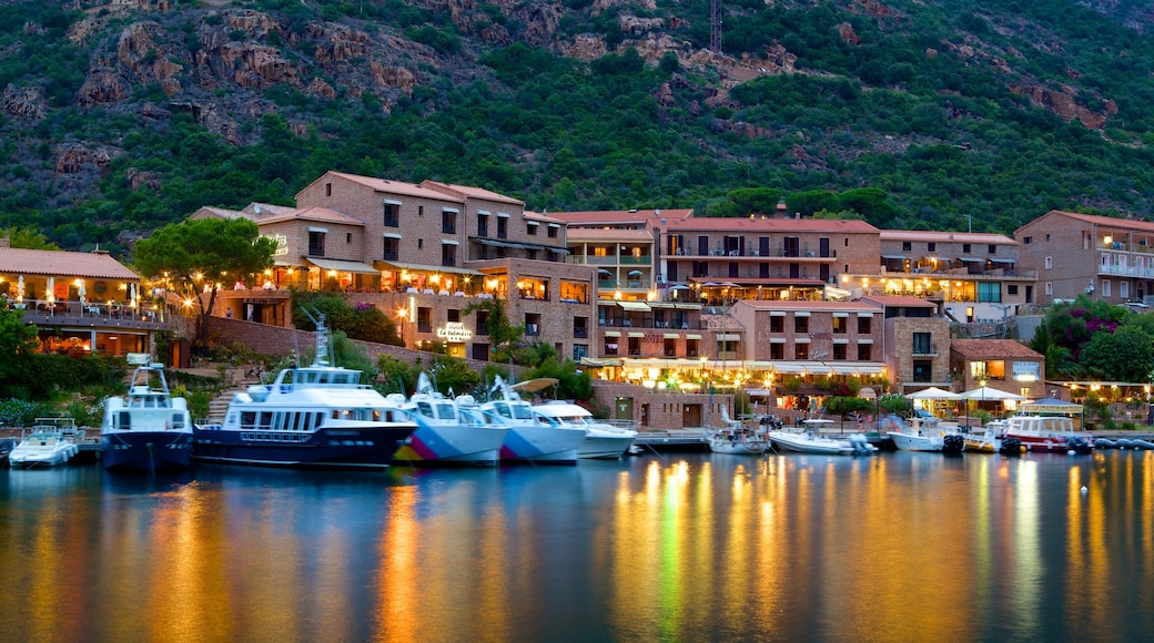 Porto Beach which includes a marina, a coastal town and a sunset