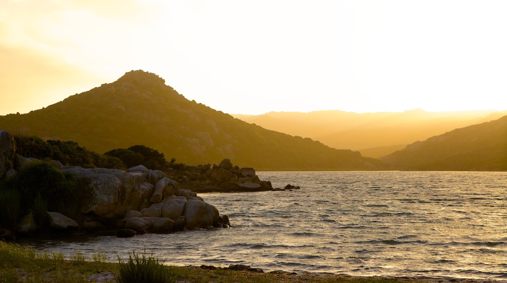 Balistra Beach featuring rugged coastline and a sunset