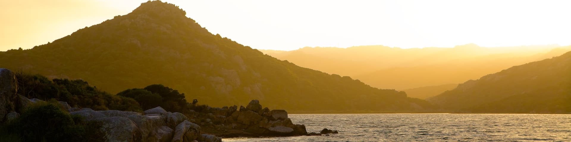 Balistra Beach showing rugged coastline and a sunset