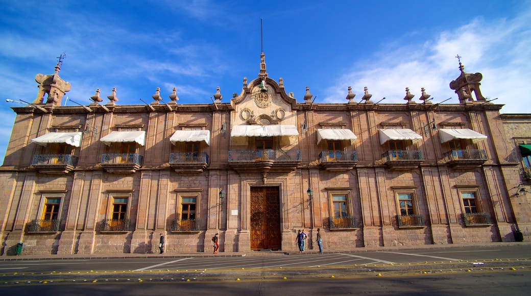 Federal Palace showing heritage architecture, an administrative building and street scenes