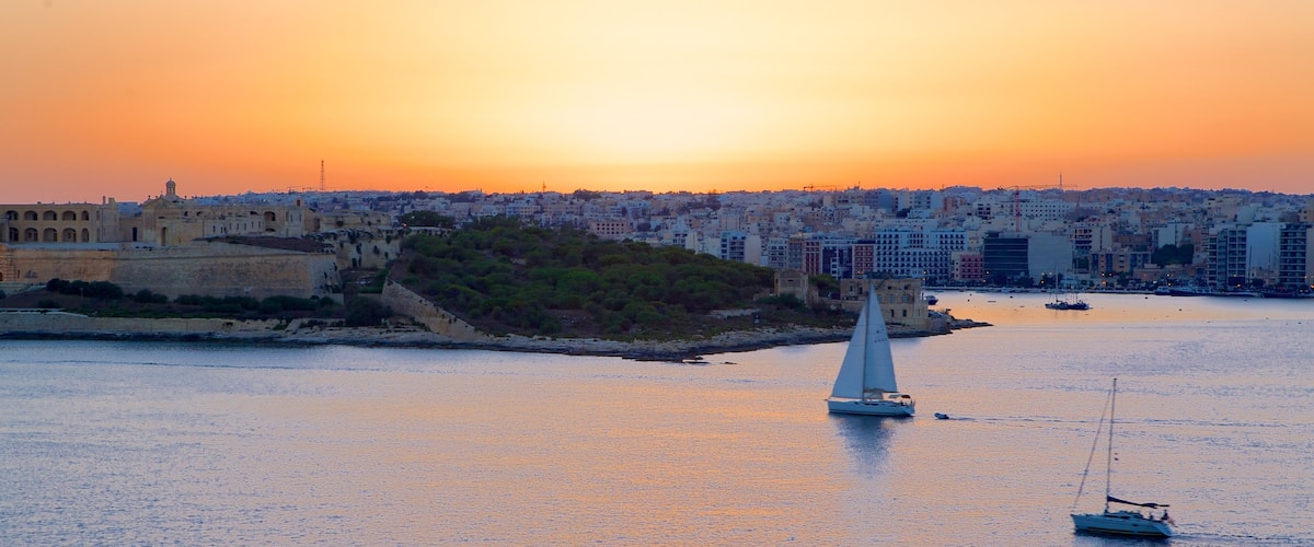 Valletta showing a sunset and a coastal town