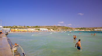 Mellieħa Bay welches beinhaltet Schwimmen und allgemeine Küstenansicht