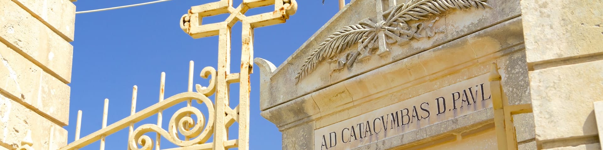 Catacombs of St. Paul and St. Agatha\'s Crypt featuring a cemetery, religious elements and heritage architecture