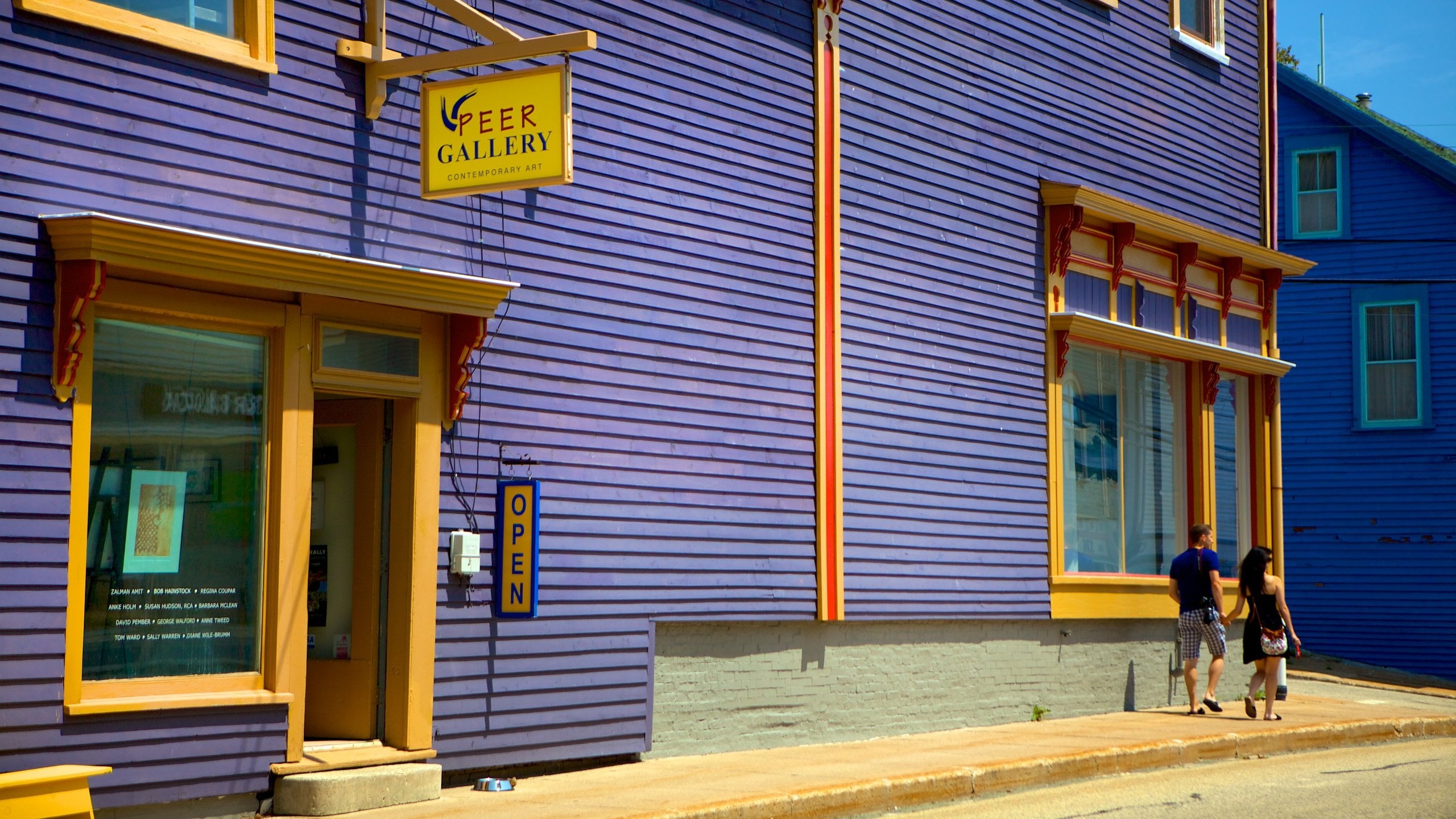 Lunenburg showing signage and street scenes as well as a couple