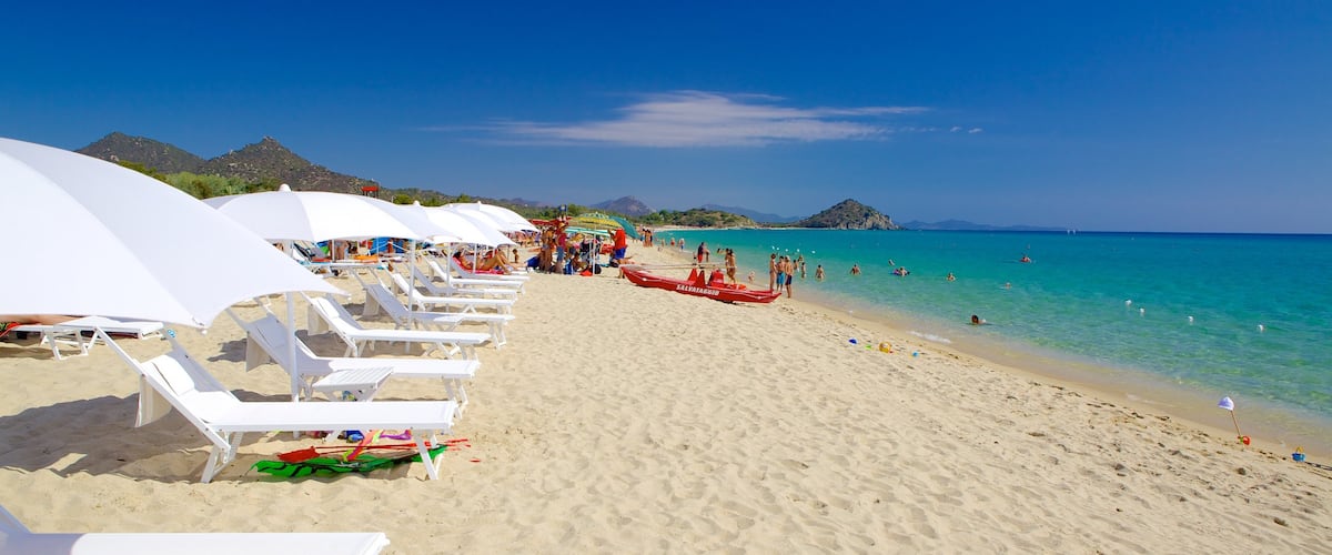Cala Sinzias showing general coastal views and a sandy beach