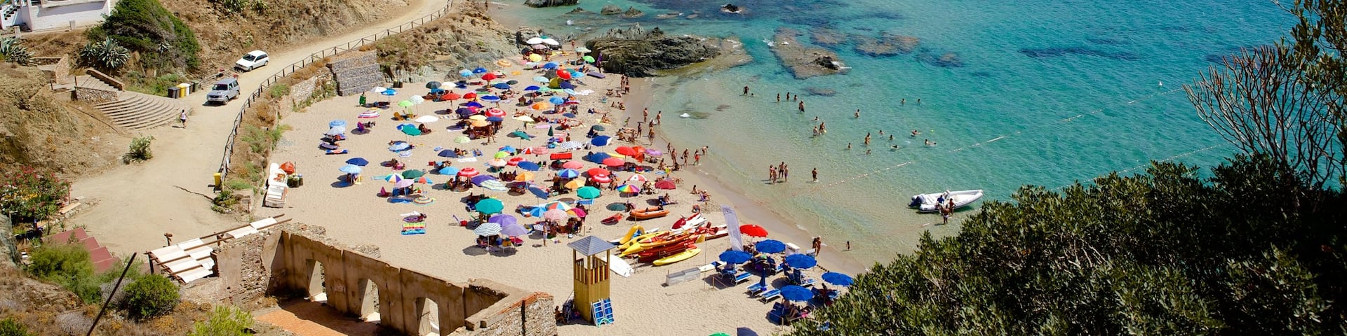 Porto Flavia featuring a sandy beach