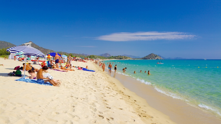Cala Sinzias which includes a sandy beach as well as a large group of people