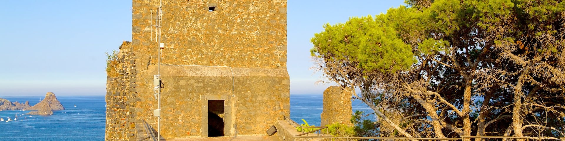 Aci Castello which includes heritage architecture and a castle