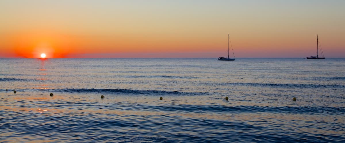 Cefalù showing a sunset and general coastal views