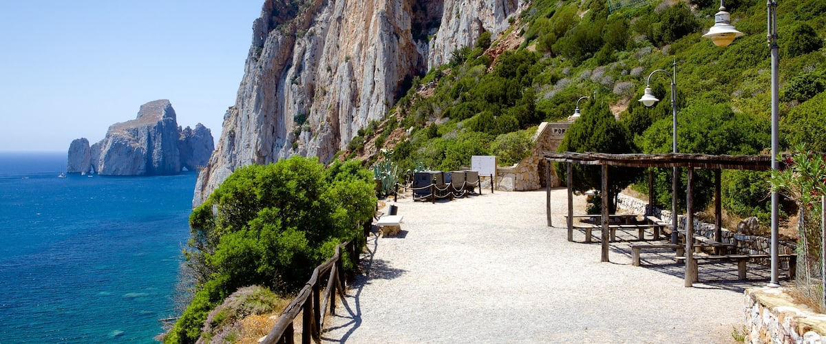 Porto Flavia featuring rocky coastline