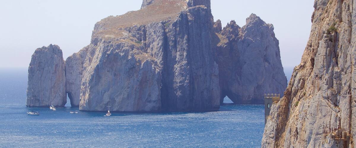 Porto Flavia which includes rugged coastline