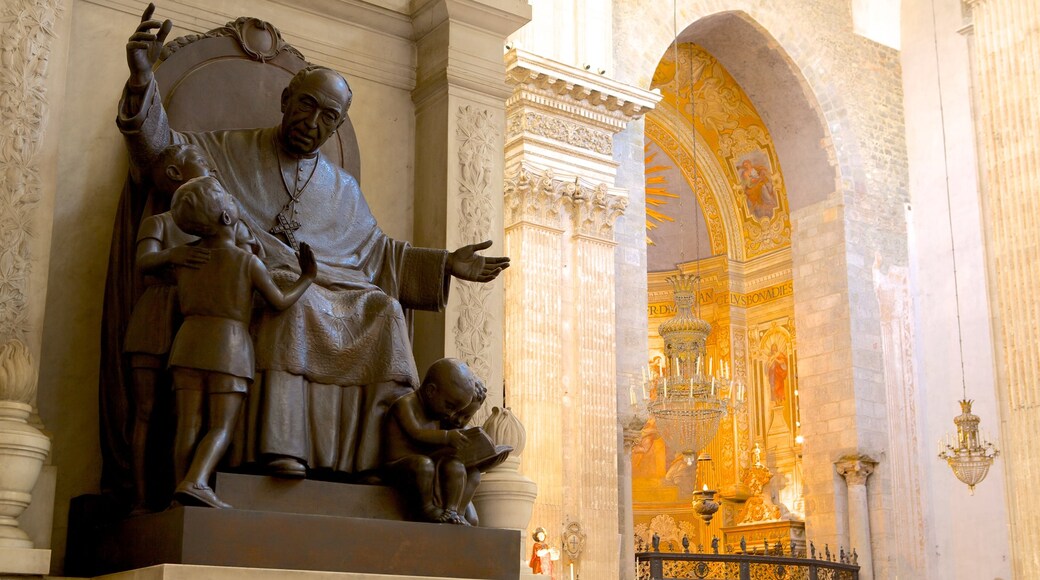 Catania Cathedral which includes interior views, a church or cathedral and a statue or sculpture