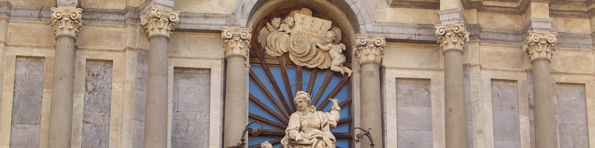 Catania Cathedral which includes a church or cathedral, religious aspects and a statue or sculpture