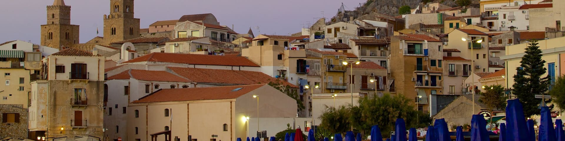 Rocca of Cefalu which includes a sunset and a small town or village