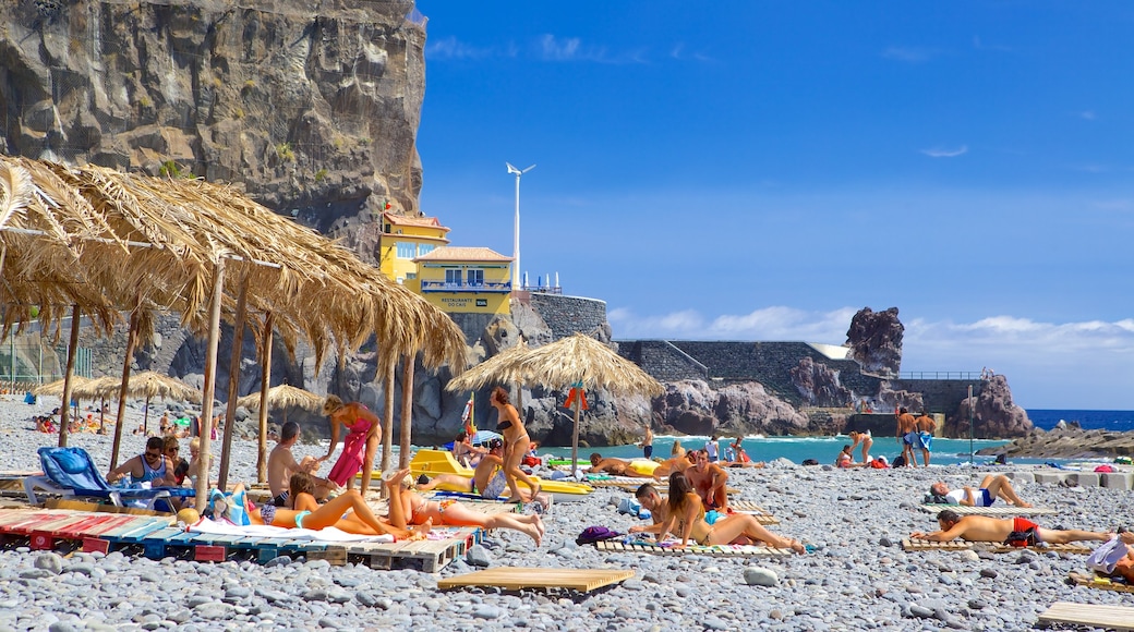 Ponta Do Sol Beach featuring a pebble beach, swimming and general coastal views