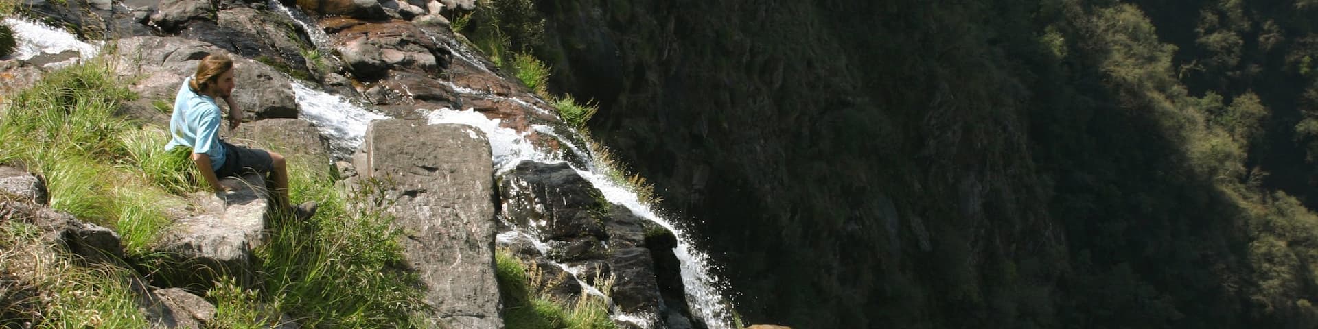Tucuman which includes a waterfall as well as an individual male