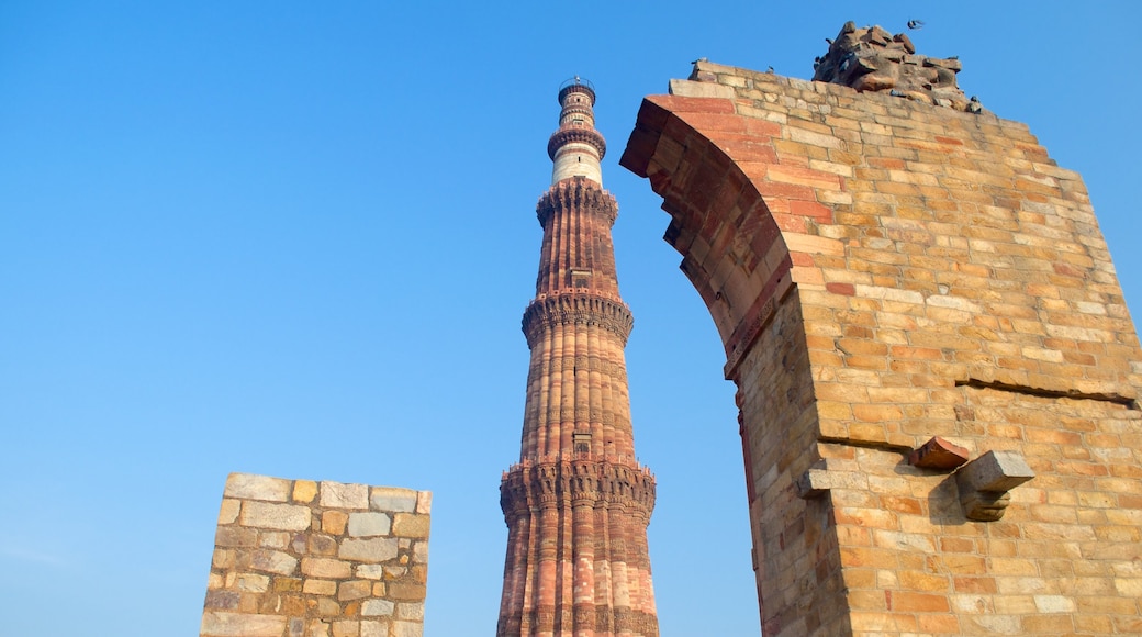Qutub Minar showing building ruins and heritage architecture