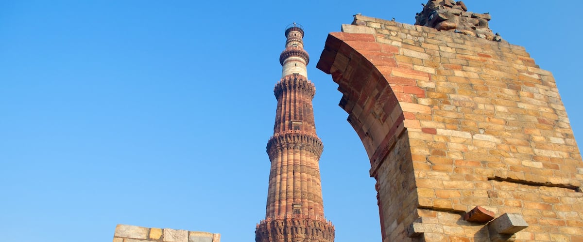Qutub Minar featuring heritage architecture and building ruins