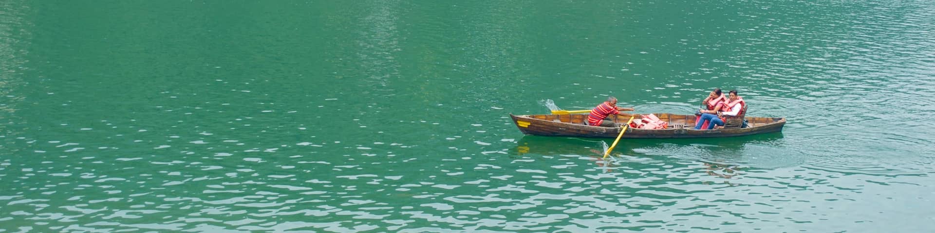 Nainital Lake featuring kayaking or canoeing and a lake or waterhole