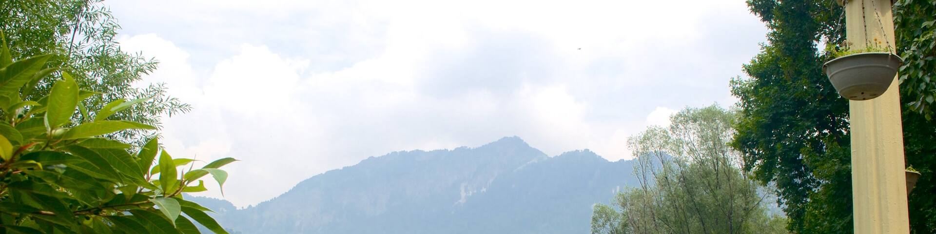 Nainital Lake featuring mountains and a lake or waterhole