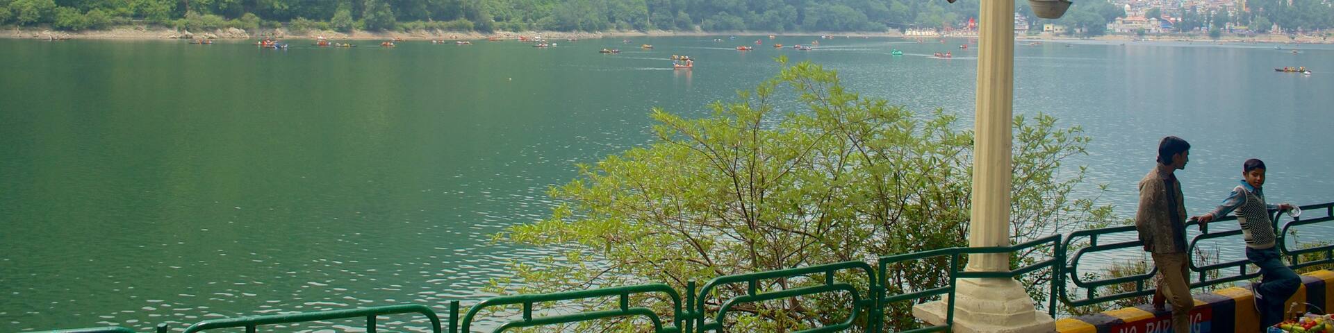 Nainital Lake showing a lake or waterhole and mountains