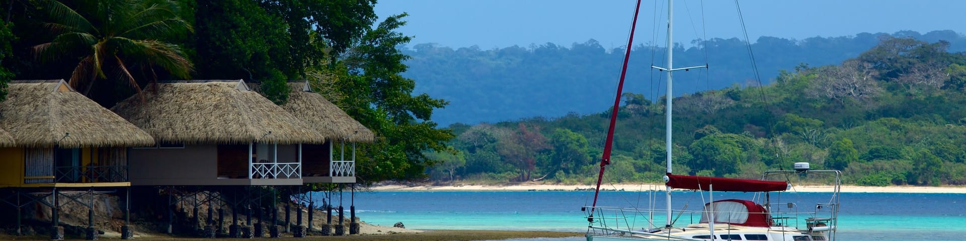 Iririki Island featuring a coastal town, tropical scenes and a bay or harbour