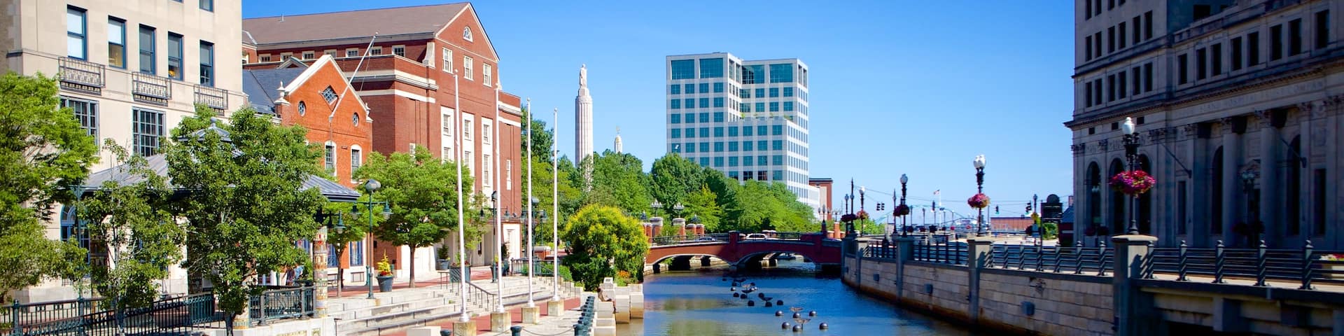 WaterFire Providence which includes a river or creek and a city