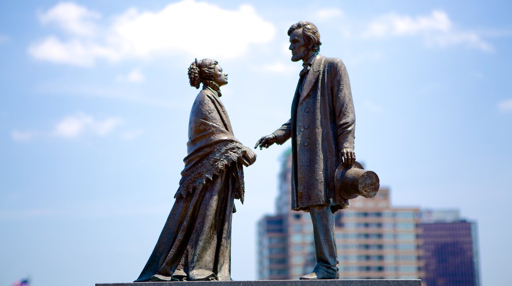 Riverside Park featuring a statue or sculpture and an administrative building