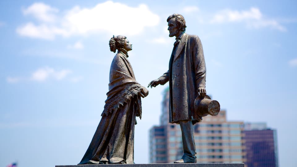 Riverside Park featuring a statue or sculpture and an administrative building