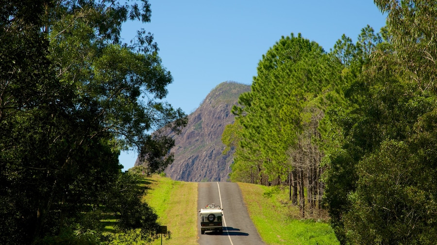 Glasshouse Mountains National Park showing tranquil scenes and vehicle touring